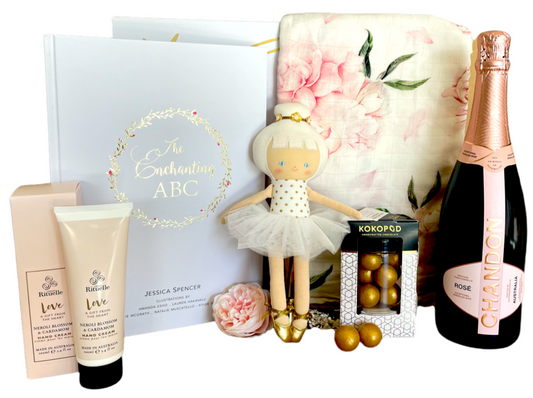 Best gift hamper for Mum and Baby indulging in Pink.  Pink champagne, pink tutus, Adored Illustrations Enchanted ABC.  Kokopod Macdamias and Urban Rituelle Hand Cream for Mum and a Ballerina doll for Bub.  Mums and Bubs Hampers with organic bamboo swaddles.  Best baby hamper. Free Delivery Sunshine Coast 
