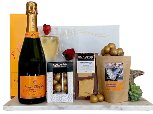 Sunset Celebration.  A glass of sparkly veuve champagne and gorgeous chocolate and nuts to nibble.
