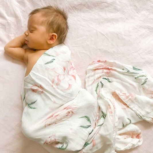 Best gift to celebrate a new baby. Pink Champagne, pink Anchor & Arrow organic swaddle. Plush pink bunny from Jiggle & Giggle, Kokopod Macadamias, Alimrose beechwood & silicon teether. Beautifully gift wrapped for new Mum and Baby. Baby girl gifts and gift boxes.